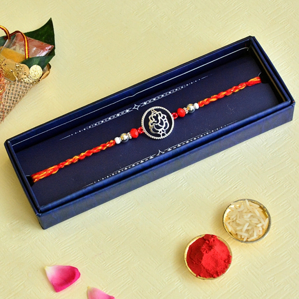 Blessed Ganesha Pure Silver Rakhi – RK-121 | Silver Charm on Sacred Red Thread for Auspicious Protection