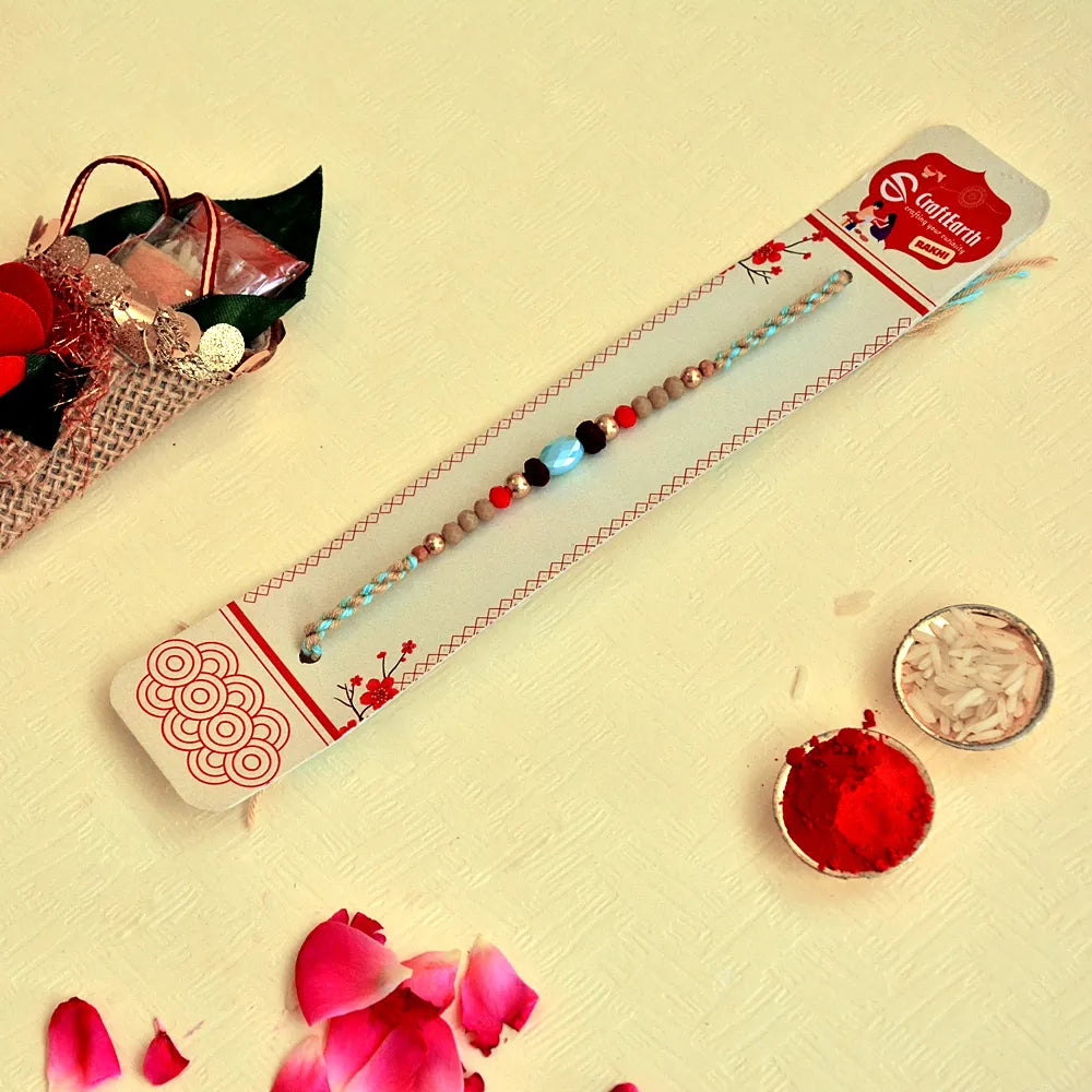 Tribal Touch Rakhi – RK-129 | Braided Blue Thread with Natural Beads & Stone Centerpiece