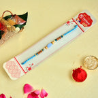 Tranquil Blue Rakhi – RK-131 | Sky Thread with Oval Bead & Wooden Accents