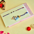 Designer Bhaiya Bhabhi Rakhi Set – RK-135 | Blue-Red Thread with Heart Charm & Beaded Bracelet