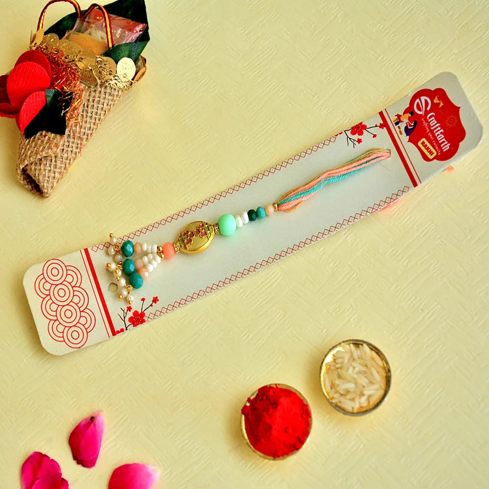 Elegant Floral Lumba Rakhi – RK-137 | Pastel Green & Peach Beads with Pearl Tassels for Bhabhi