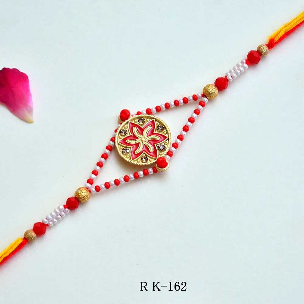 Red Blossom Rakhi – RK-162 | Traditional Rakhi with Floral Centerpiece & Pearl Bead Detailing for Brother