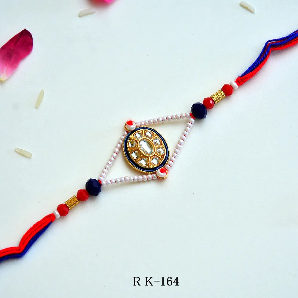 Kundan Oval Rakhi – RK-164 | Traditional Rakhi with Pearl Beads & Blue Thread Detailing for Brother