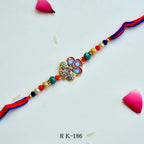 Regal Blossom Rakhi – RK-186 | Elegant Floral Rakhi with Stone Studded Center & Multicolor Beads for Brother