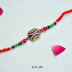 Wave Crest Rakhi – RK-187 | Unique Rakhi with Wavy Crystal Design & Colorful Beads