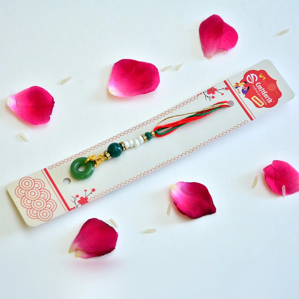 Jade-Inspired Lumba Rakhi - RK-290 | Elegant Green Thread Rakhi with Pearls & Gold Accents