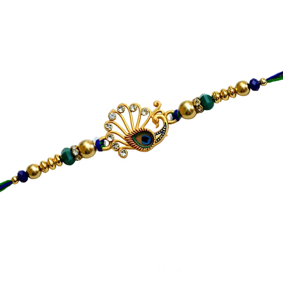 Peacock Feather Rakhi – RK-203 | Elegant Rakhi with Kundan Work & Blue-Green Beads