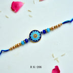 Royal Blue Lotus Mandala Rakhi – RK-206 | Meenakari Round Dial Rakhi with Crystal Accents