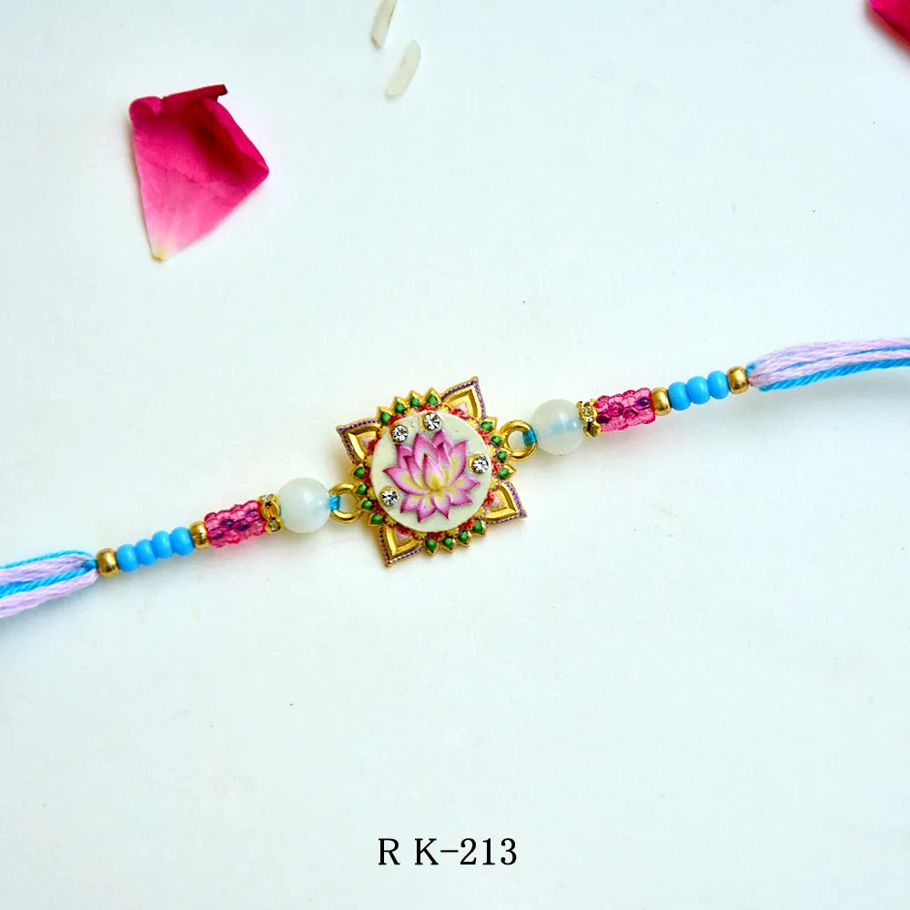 Lotus Elegance Rakhi – RK-213 | Artistic Lotus Design Rakhi with Pink & Blue Beads