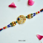 Divine Shree Symbol Rakhi – RK-216 | Elegant Spiritual Rakhi with Beads & Enamel Work