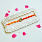 Royal Turban Rakhi – RK-227 | Traditional Brass Motif on Braided Yellow-Red Thread