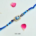 Blue Evil Eye Rakhi – RK-236 | Protective Glass Bead Rakhi with Luxe Golden Frame & Blue Thread