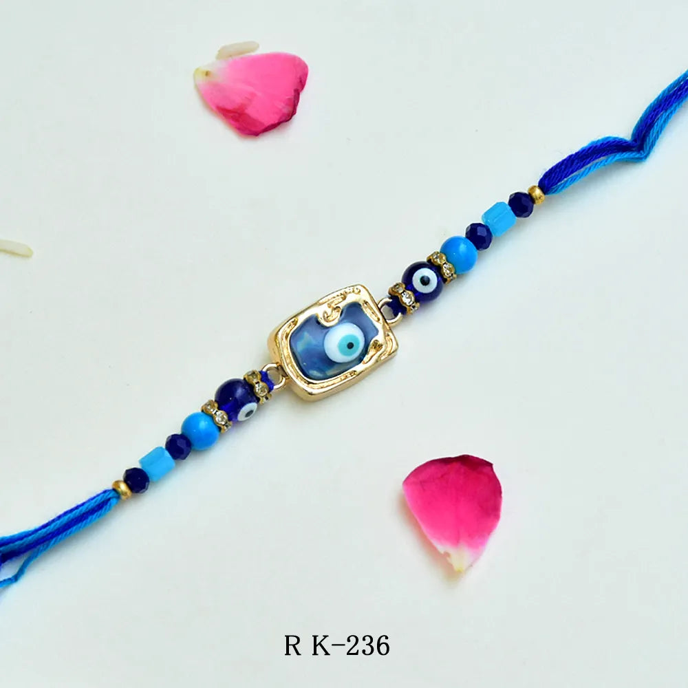 Blue Evil Eye Rakhi – RK-236 | Protective Glass Bead Rakhi with Luxe Golden Frame & Blue Thread