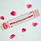 RK-255 | Elegant Wooden Bead Rakhi with Red Accents on Braided Thread (Set of 12)