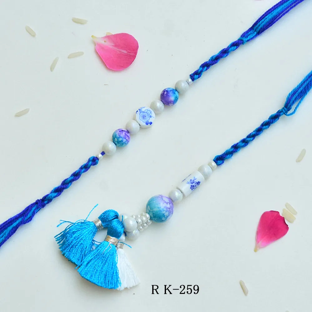 Elegant Blue Ceramic Bead Rakhi – RK-259 | Designer Rakhi with Pearl & Thread Detailing
