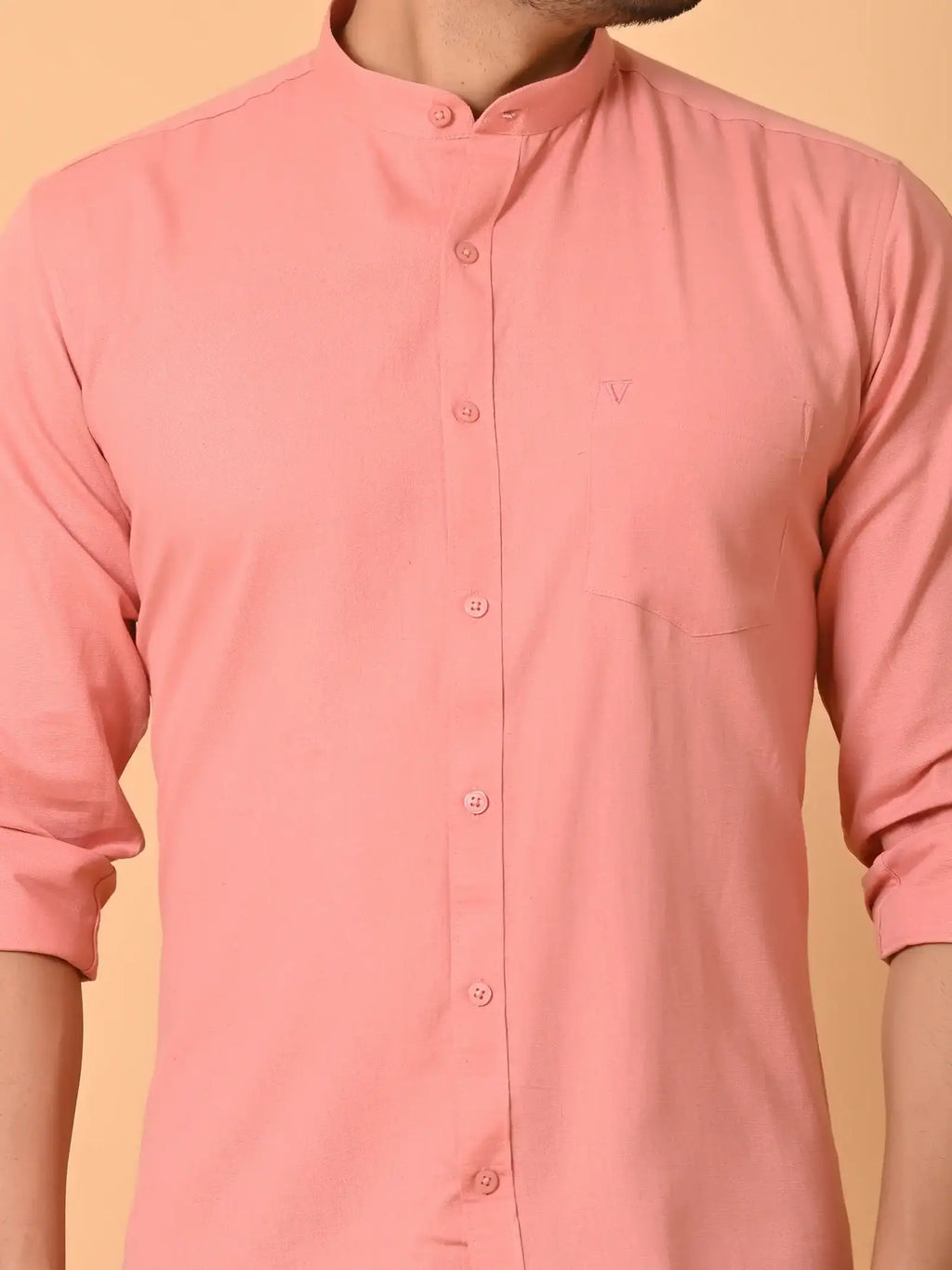Soft pink men's casual shirt with mandarin collar, front buttons, and chest pocket, perfect for stylish everyday wear. Crafted from eco-friendly materials by Craftearth for sustainable fashion.
