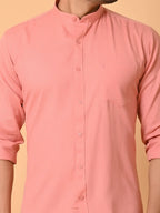 Soft pink men's casual shirt with mandarin collar, front buttons, and chest pocket, perfect for stylish everyday wear. Crafted from eco-friendly materials by Craftearth for sustainable fashion.
