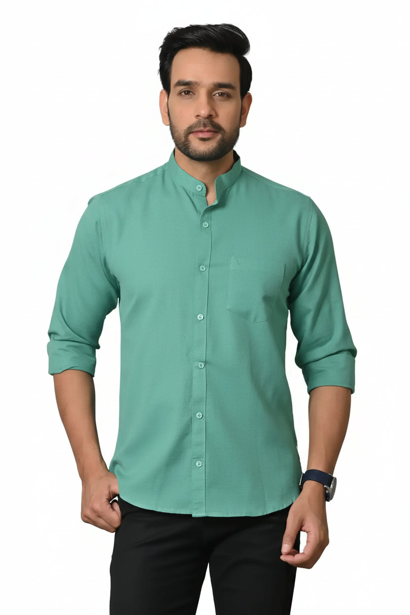 Bright green men's kurta with mandarin collar, long sleeves, and button-down front, perfect for traditional or casual wear, styled with black pants and wristwatch.