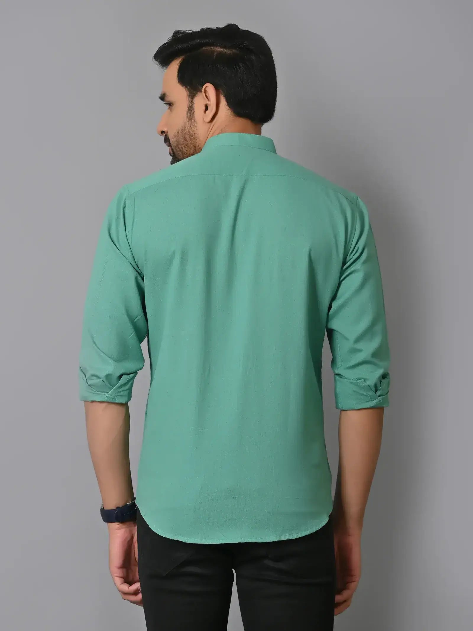 Soft mint green men's shirt with roll-up sleeves, back view, casual style, stylish fashion, comfortable fit, trendy clothing.