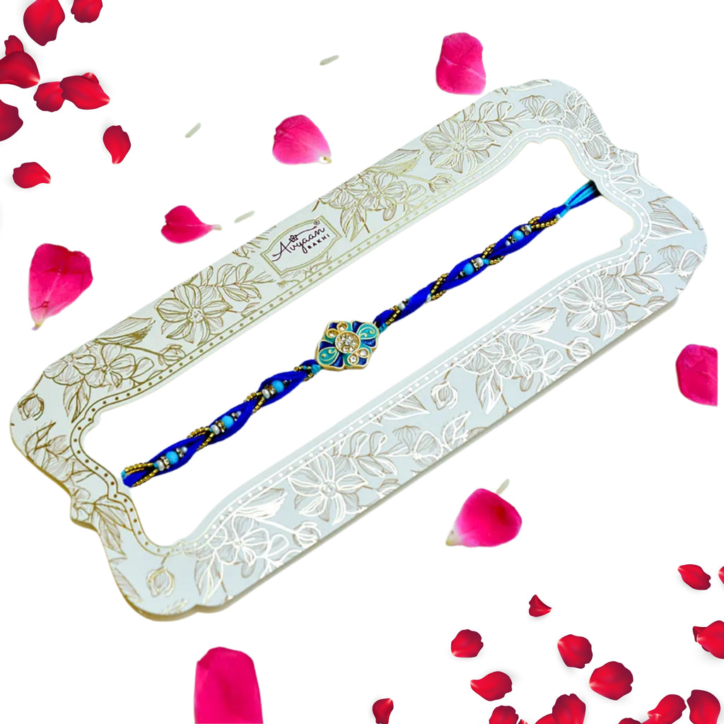 Ocean Bloom Rakhi – RK-228 | Blue Thread Rakhi with Floral Enamel & Crystal Detailing