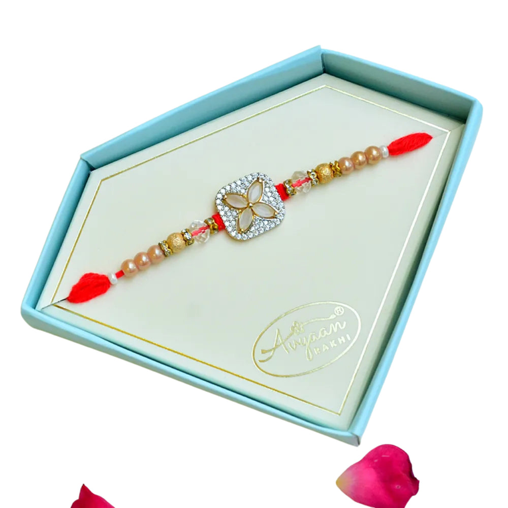 Elegant Floral Stone Rakhi – RK-249 | Red Thread with Gold & Crystal Beads