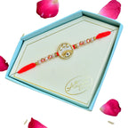 Eye Motif Designer Rakhi – RK-248 | Red Thread with Crystal Beads and Gold Accents