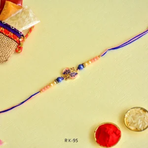Charming Leaf Motif Rakhi – RK-95 | Elegant Pink & Blue Thread with Pearl and Bead Detailing