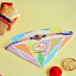Charming Leaf Motif Rakhi – RK-95 | Elegant Pink & Blue Thread with Pearl and Bead Detailing - Image 2