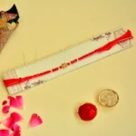 Minimal Elegance Rakhi – RK-108 | Star Charm in Red & Pearl Beads - Image 2