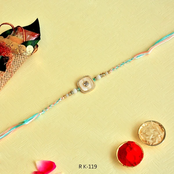 Pastel Elegance Rakhi – RK-119 | Soft Multicolor Thread with Pearl-White Center & Crystal Frame - Image 3