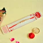 Classic Elegance Rakhi – RK-126 | Beige Beads with Gold Highlights on Red Thread - Image 3