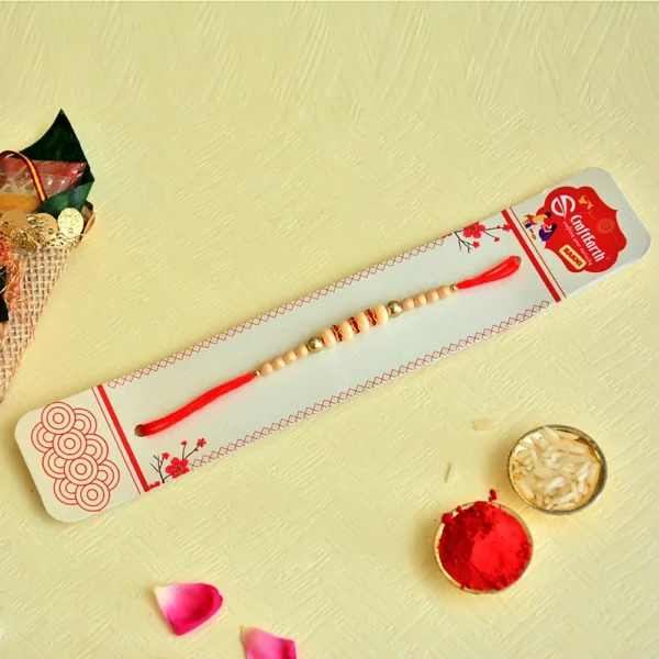 Classic Elegance Rakhi – RK-126 | Beige Beads with Gold Highlights on Red Thread - Image 3