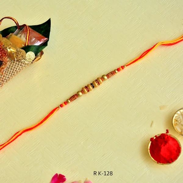 Festive Elegance Rakhi – RK-128 | Bright Orange Thread with Ornate Beads - Image 3