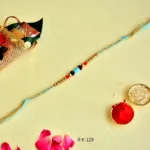Tribal Touch Rakhi – RK-129 | Braided Blue Thread with Natural Beads & Stone Centerpiece - Image 3