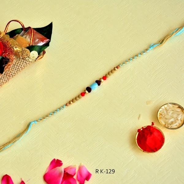 Tribal Touch Rakhi – RK-129 | Braided Blue Thread with Natural Beads & Stone Centerpiece - Image 3