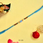 Tranquil Blue Rakhi – RK-131 | Sky Thread with Oval Bead & Wooden Accents - Image 3