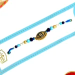 Chic Evil Eye Rakhi – RK-88 | Sleek Gold Charm with Blue & White Beads for Stylish Protection - Image 4