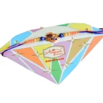 Charming Leaf Motif Rakhi – RK-95 | Elegant Pink & Blue Thread with Pearl and Bead Detailing - Image 4