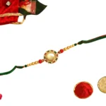 Regal Radiance Rakhi – RK-41 | Circular Kundan Dial with Pearl & Thread Detailing - Image 3