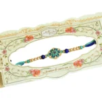 Floral Motif Rakhi – RK-52 | Blue-Green Thread with Pearls & Enamel Charm - Image 4