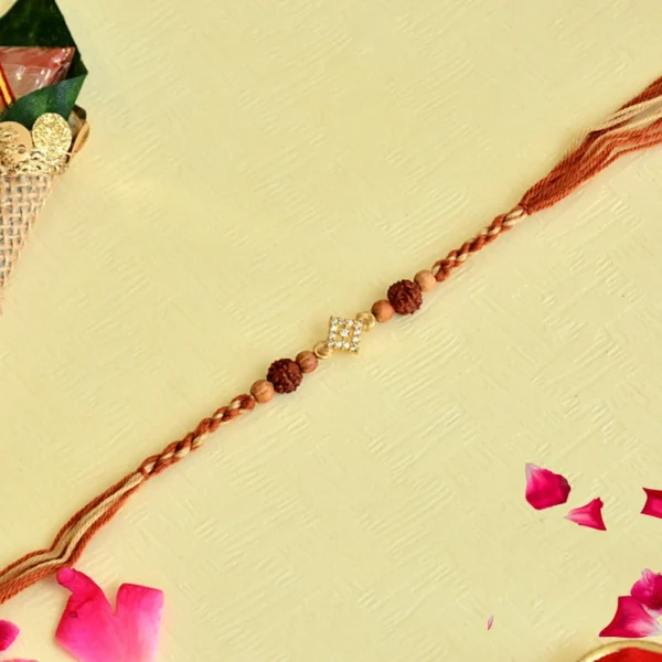 Rudraksha Elegance Rakhi – RK-110 | Divine Design with Subtle Sparkle - Image 1