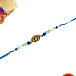 Chic Evil Eye Rakhi – RK-88 | Sleek Gold Charm with Blue & White Beads for Stylish Protection - Image 3