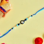 Blue Evil Eye Rakhi – RK-85 | Stylish Rakhi with Beads & Nazar Suraksha Charm for Brother