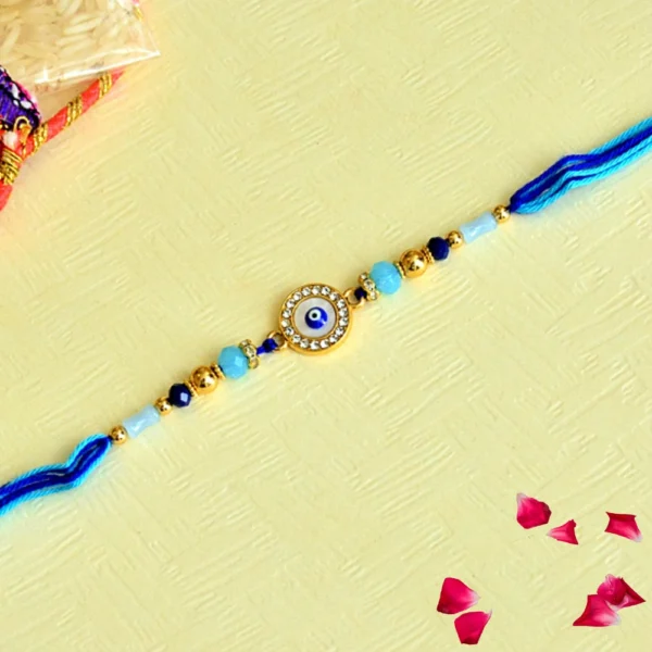Elegant Nazar Suraksha Rakhi – RK-87 | Crystal-Studded Evil Eye Charm with Blue & Gold Beads for Brother