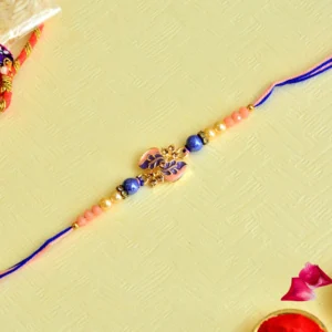 Charming Leaf Motif Rakhi – RK-95 | Elegant Pink & Blue Thread with Pearl and Bead Detailing