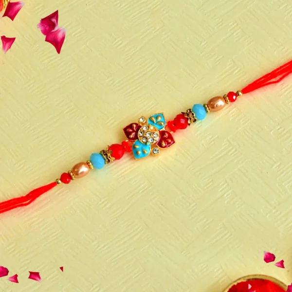 Festive Floral Rakhi – RK-96 | Vibrant Red Thread with Blue & Gold Beads and Kundan-Style Charm