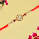 Spiritual Om Rakhi – RK-117 | Red Thread with Rudraksha & Pearl Beads