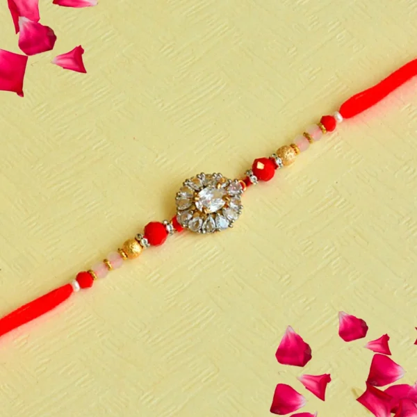 Crystal Bloom Rakhi – RK-118 | Red Thread with Floral Zircon Center & Gold Bead Detailing - Image 1
