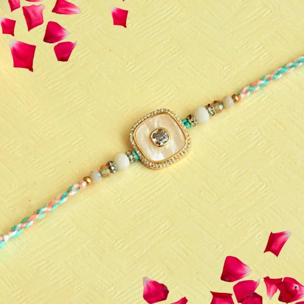 Pastel Elegance Rakhi – RK-119 | Soft Multicolor Thread with Pearl-White Center & Crystal Frame - Image 1