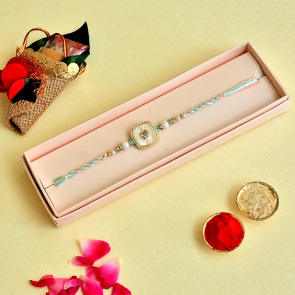 Pastel Elegance Rakhi – RK-119 | Soft Multicolor Thread with Pearl-White Center & Crystal Frame - Image 2